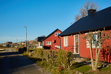 Image showing Red house at sea shore in the baltic sea in dull colors in autumn.