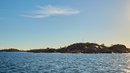 Image showing Red house at sea shore in the baltic sea in dull colors in autumn.