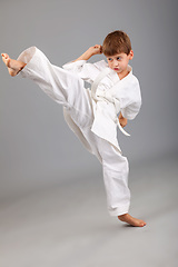 Image showing Karate boy in white kimono fighting