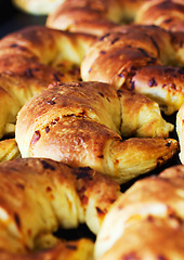 Image showing Bakery, croissant and bread in a store with coffee shop food and product in a kitchen. Fresh, closeup and French pastry with patisserie and dessert in a cafe with flour and wheat for a snack