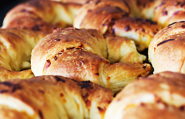 Image showing Bakery, croissant and bread in a retail store with coffee shop food and product in a kitchen. Fresh, closeup and French pastry with patisserie and dessert in a cafe with flour and wheat cooking snack