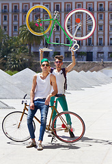 Image showing Bicycle, men and friends in a city street with freedom, holiday or vacation, pose and attitude on urban background. Bike, cyclist and people outdoors for cycling, fitness and having fun in London