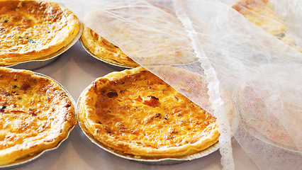 Image showing Bakery, quiche and bread pastry in a store with coffee shop food and product in a kitchen. Savory pie, closeup and diner with cloth and vegetable dessert in a cafe with flour and crust for a snack