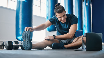 Image showing Stretching, fitness and a man with a laptop for exercise tutorial, information or a cardio video. Happy, gym and a male athlete with an online warm up on a computer before training and a workout