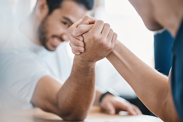 Image showing Strong, hands and closeup of men arm wrestling on a table while being playful for a challenge. Rivalry, game and zoom of male people doing a strength muscle battle for fun, bonding and friendship.