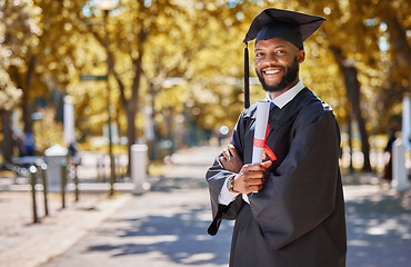 Image showing Graduation portrait, diploma and man or student on university, education or college campus and scholarship success. African person or happy graduate arms crossed with certificate or award in park