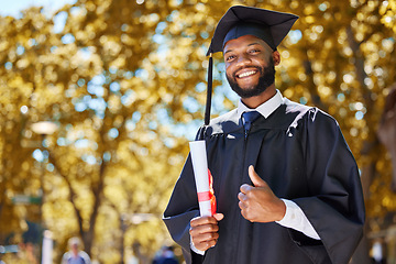 Image showing Graduation portrait, thumbs up and man or student on university, education or college campus in diploma success. African person or graduate like, yes and excellence sign, certificate or award in park