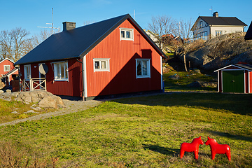 Image showing Red house at sea shore in the baltic sea in dull colors in autumn.