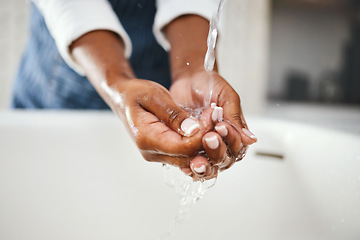 Image showing Woman cleaning hands, water and hygiene in bathroom, safety from bacteria and germs, disinfection and skincare. Health, wellness and female person at home, sustainability and healthy with handwashing