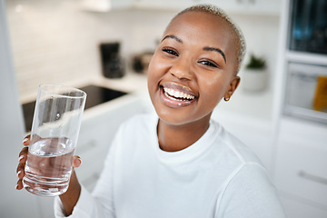 Image showing Portrait, glass and black woman drinking water, smile and health with joy, nutrition and laughing. Face, female person or happy girl in her kitchen, liquid and home with happiness, wellness and detox