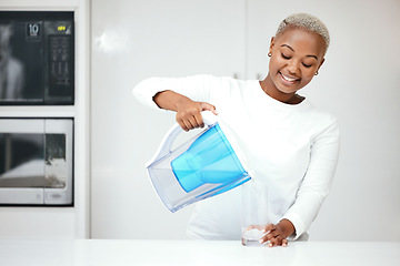 Image showing Water, filter and black woman with jug in kitchen to refresh with glass, liquid and cold hydration. Happy, thirsty and female person pouring pure aqua beverage from pitcher for clean drinking at home