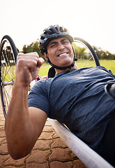 Image showing Portrait, cycling and a winner man with disability in celebration of success in a sports competition. Exercise, smile and motivation with a young male cyclist athlete on a custom bike for training