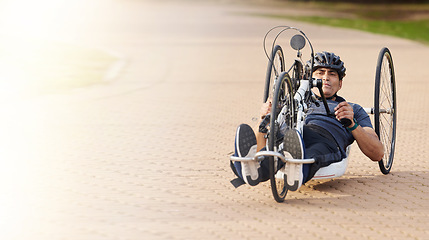 Image showing Man with disability, handbike and outdoor bicycle for sports, race or exercise power with flare of mockup space. Fitness, male athlete with paraplegia and cycling in competition, challenge or contest
