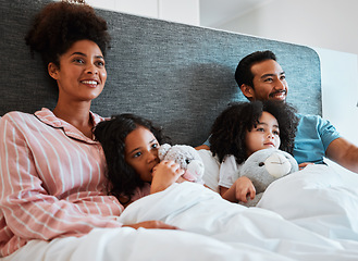 Image showing Bed, home and relax happy family watching tv show, subscription movie or streaming entertainment film. Bonding, morning love or bedroom people watch television, media or cartoon video in apartment