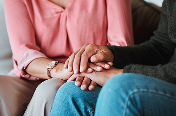 Image showing Closeup, couple and holding hands to forgive, love and care with empathy at home. Life partner, helping hand and support of man, woman and hope for kindness, trust or gratitude for therapy of anxiety