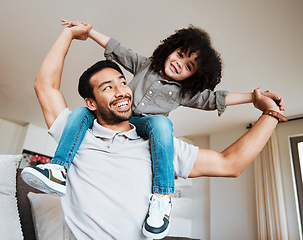Image showing Love, airplane and father and boy child in a living room for piggyback, bond and fun in their home. Happy, flying and kid with parent in lounge playing, flying and enjoy shoulder game on the weekend