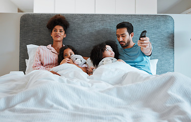 Image showing Bed, relax or family watch television show, home subscription movie or streaming morning film broadcast. Remote control, bedroom child love or people watching tv, bonding or change channel to cartoon