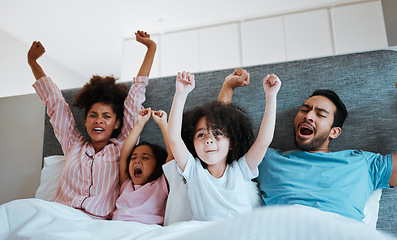 Image showing Bed, celebration and excited happy family watching tv show, children movie or bonding cheers for film. Home fans, morning kids and bedroom people scream for sports team, television or celebrate video