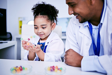 Image showing Science, research and child with her father in the lab working on an experiment or test with sweets. Biology, candy and girl kid student doing project with dad scientist in pharmaceutical laboratory.