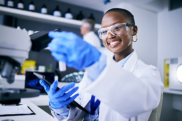 Image showing Black woman, test tube or happy scientist with tablet for pharmaceutical research, innovation or medicine. Medical data, smile or African biologist in science analysis in laboratory studying a cure
