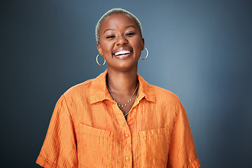 Image showing Smile, laugh and portrait of black woman laughing in studio at silly, joke or funny against a gradient grey background. Happy, laugh and face of African female with positive attitude or good vibes