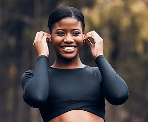 Image showing Fitness, black woman listening to music and in forest with earphones happy for motivation. Training or workout, exercise or health wellness and female athlete listen to radio or podcast in woods