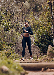Image showing Fitness, running and health with black woman in nature for workout, wellness and morning. Exercise, challenge and performance with female runner on forest trail for training, marathon and cardio