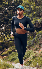 Image showing Fitness, black woman and workout in forest for health wellness in sportswear. Commitment or exercise, motivation or running and African female athlete training for marathon in woods outdoor.