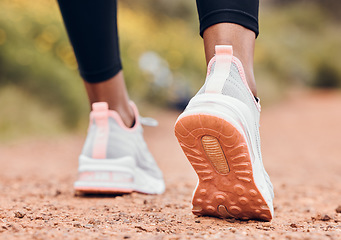 Image showing Shoes, fitness and person walking or hiking for outdoor exercise, workout or training as health and wellness. Sneakers, closeup and feet of active sports athlete or runner running a marathon