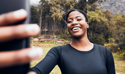 Image showing Fitness, black woman taking a selfie and in forest for social media motivation. Workout sportswear or training, exercise or health wellness and African female athlete happy in woods for running