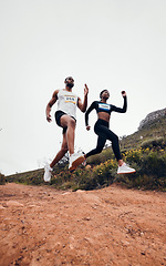 Image showing Running, jump and couple in mountain with fitness workout and training on a race and marathon. Runner, young people and road on a exercise challenge outdoor with sport cardio performance in nature