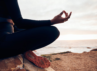 Image showing Lotus pose, hands and yoga at the beach, fitness and meditation, spiritual wellness with person in nature. Exercise, zen and yogi on rock outdoor with holistic healing and calm, sea and mindfulness