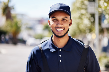 Image showing Happy, delivery and portrait of a man in the city for courier work and ecommerce job. Smile, retail and a headshot of a male service worker in the shipment industry and in town while working