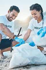 Image showing Volunteer, man and woman cleaning beach for world earth day, care and kindness for nature and environment. Help, recycling and happy people at ngo collect plastic waste and pollution from ocean sand.