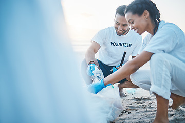 Image showing Volunteer, mockup and people cleaning beach for world earth day, care and kindness for natural environment. Help, recycle and happy man and woman picking up plastic waste and pollution on ocean sand.