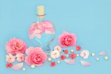 Image showing Rosewater for Skincare with Rose and Carnation Flowers