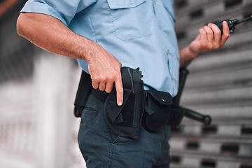 Image showing Closeup, law or police officer with a gun, safety or career with legal enforcement, armed or crime. Zoom, man or security guard with service weapon, protection or danger with walkie talkie or uniform