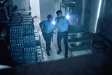 Image showing Security, emergency and team of police investigate a crime in a store at night or in the evening for protection. Teamwork, job and professional safety employees search a room for criminal danger