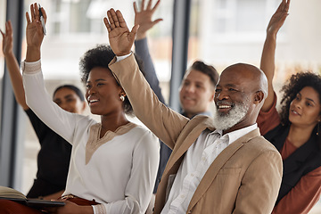 Image showing Happy business people, workshop or hands up for participation in seminar for learning skills in office. Vote, men or women in audience together for group mentorship, training or coaching in workplace