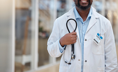 Image showing Hospital, doctor and hands of black man with stethoscope for cardiology, consulting and medical service. Healthcare, clinic and closeup of male health worker with equipment for support, exam and help