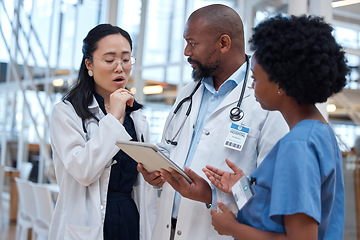 Image showing Doctors, mistake and healthcare team fail and scared with paperwork or planning in a hospital and talking with fear. Document, diversity and bad professional group in discussion or conversation