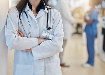 Image showing Hospital, doctor and crossed arms of woman with stethoscope for cardiology, consulting and medical service. Healthcare, clinic and female health worker with equipment for support, exam and wellness