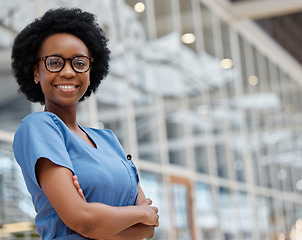 Image showing Nurse, arms crossed and portrait of black woman in hospital for medical, support and expert. Medicine, healthcare and nursing with female person in clinic for wellness, life insurance and surgery