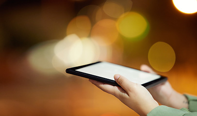 Image showing Woman, hands and tablet with mockup screen at night in city for communication, networking or browsing. Hand of female person or freelancer working late with technology display in an urban town