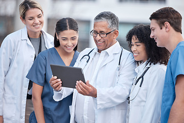 Image showing Tablet, doctors and healthcare people at hospital outdoor with clinic management, research and online teamwork. Group, telehealth and medical staff, nurses and mentor with digital technology training