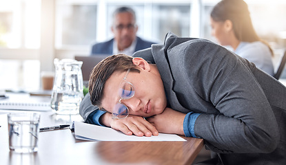 Image showing Sleeping, tired and business man in meeting for overworked, exhausted and stress. Mental health, fatigue and burnout with male employee in office for insomnia, conference and time management