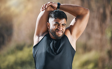 Image showing Fitness, stretching and man outdoor for training, running or workout on blurred background. Arm, stretch and Indian guy runner with body warm up in nature before exercise, run or cardio sport routine