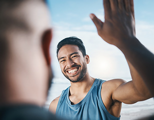 Image showing Happy man, fitness and high five for success, partnership or victory in achievement after workout in nature. Male person or men touching hands in team building, motivation or exercise goals on beach