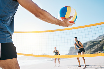 Image showing Start, team and man with a volleyball at the beach for summer sports, fitness and game. Hand, friends and people ready for cardio, workout or a competition at the ocean in spring for fun and training