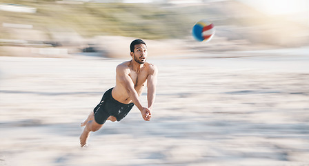 Image showing Sports, beach and man diving for volleyball, fun competition and contest with motion blur. Strong male person jump in air to hit ball at sea for fitness, outdoor summer games or action of performance